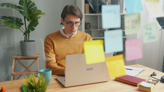 Professional adult looking at an unfinished to-do list, illustrating common signs of adult ADHD.