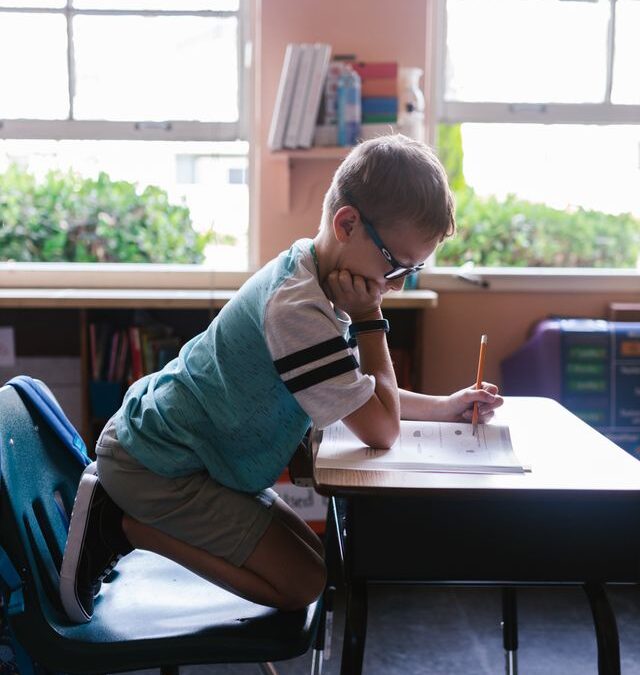 Child in classroom working on schoolwork