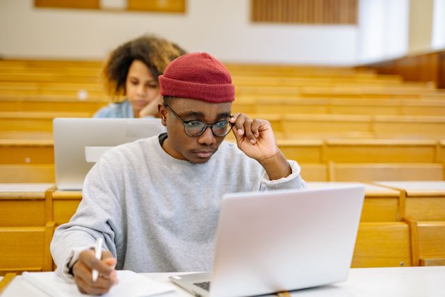 College student in class using a laptop