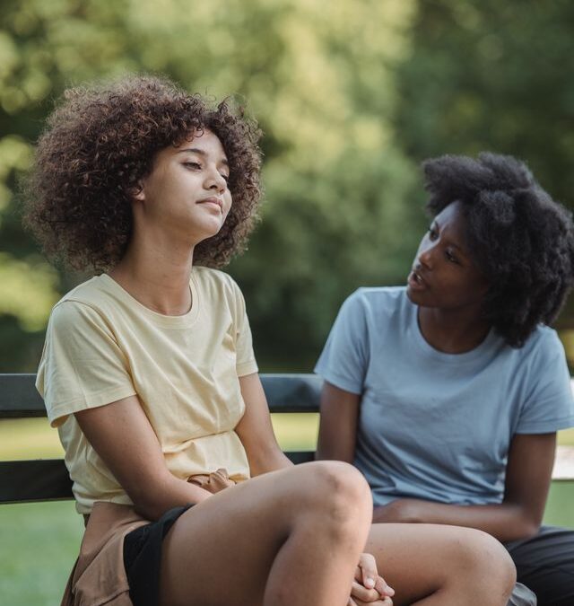Mother talking with her teenage daughter during a quiet moment together