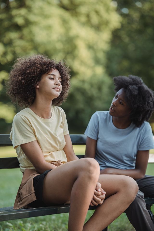 Mother talking with her teenage daughter during a quiet moment together